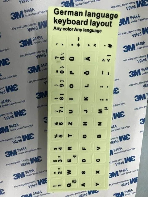 Yellow glowing PVC keyboard stickers with Arabic, Thai, Hebrew, French, Italian, and German language characters