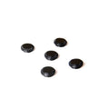 Black plastic camera shutter cover button 1cm diameter on white background