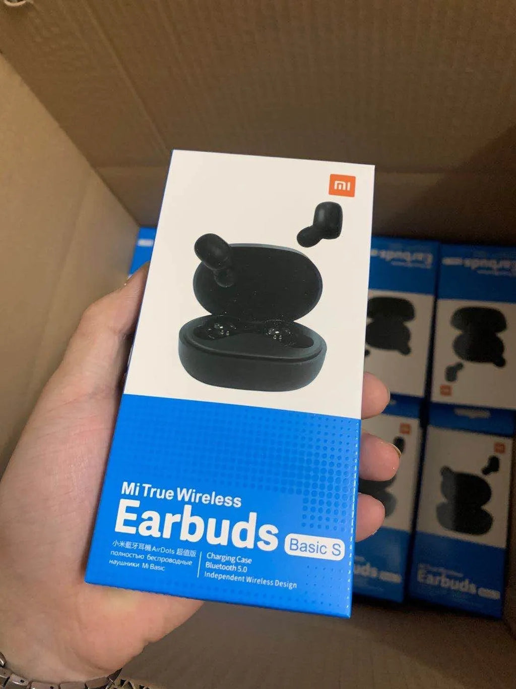 Black Redmi AirDots 2 true wireless earphones with charging case and three sizes of silicone ear tips.