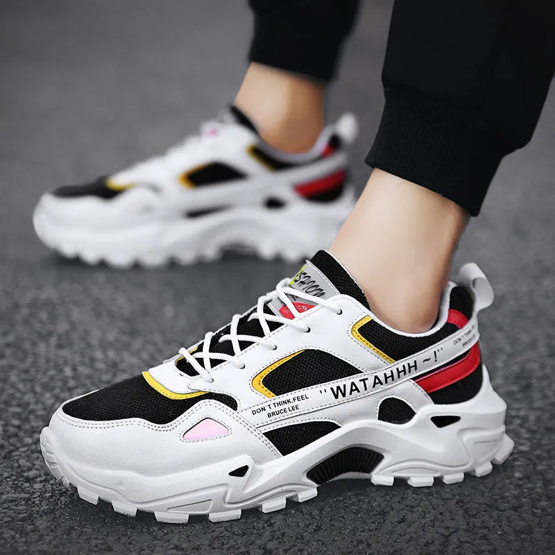 Men's breathable casual sneakers in black white colour-blocked pattern with lace-up front