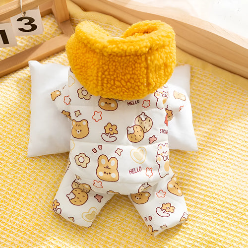 Yellow quilted cotton four-legged dog coat with sherpa hood and bear print on white background