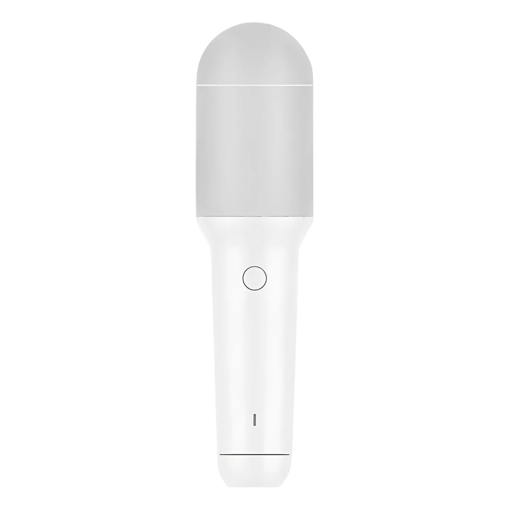 White wireless karaoke microphone with built-in speaker and metal mesh grille on a plain background
