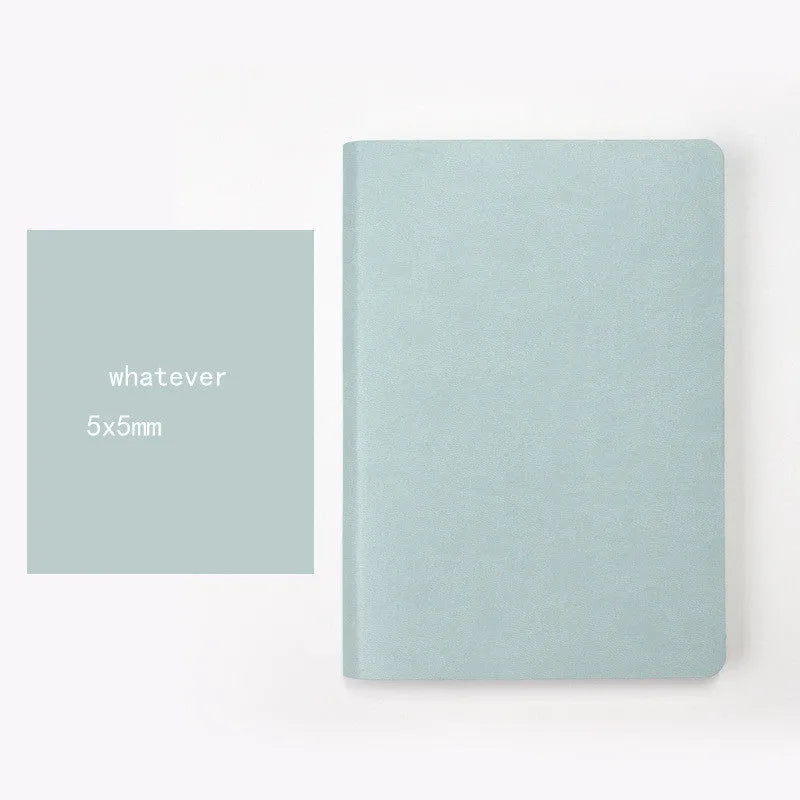 Blue A5 dotted notebook with soft imitation leather cover open to show dot grid pages
