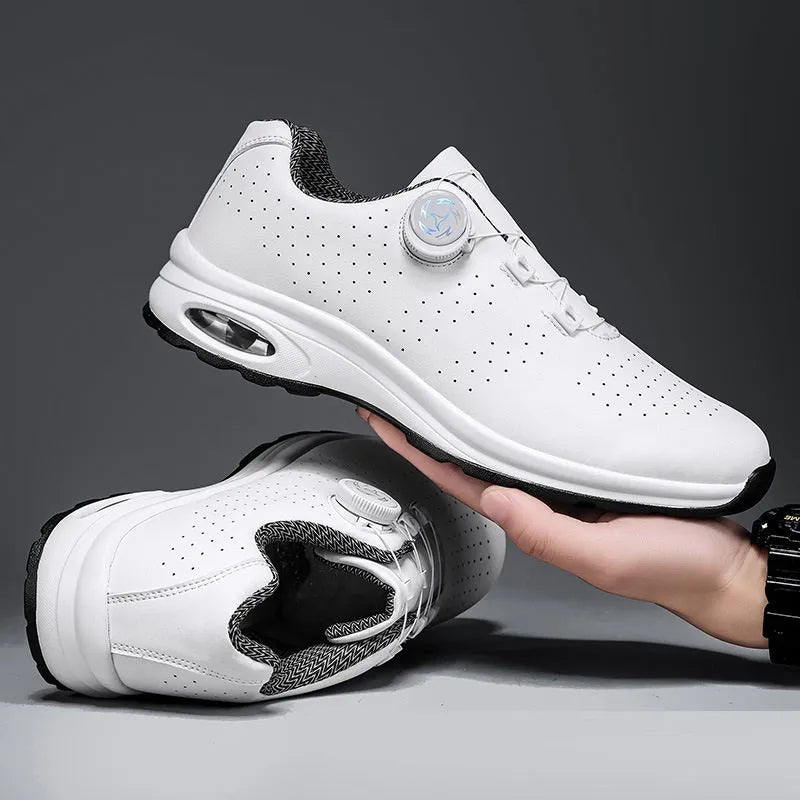 Black and white low top casual tennis shoes with cross shoulder straps and mesh upper.