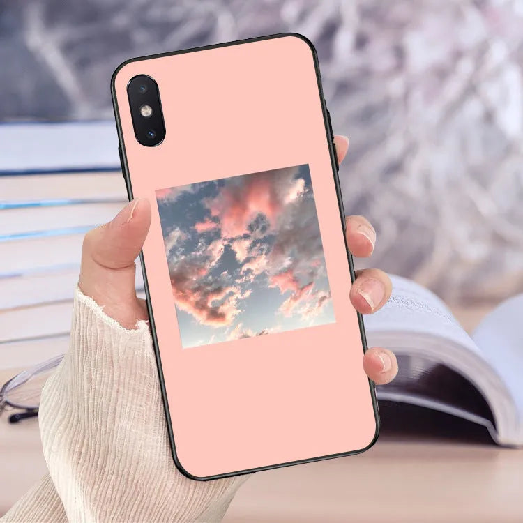 Painted pink iPhone case with brush stroke lattice and floral designs on flexible TPU material