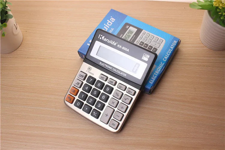 Compact aluminium desktop calculator in silver-grey finish, approximately 14.5cm long, for basic office calculations