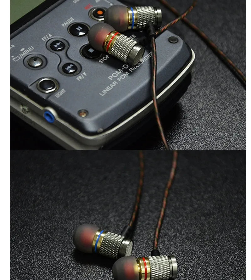 Close-up of wired in-ear headphones with metal subwoofer, TPE earplugs, and a 3.5mm L-bend plug on a silicone cable.