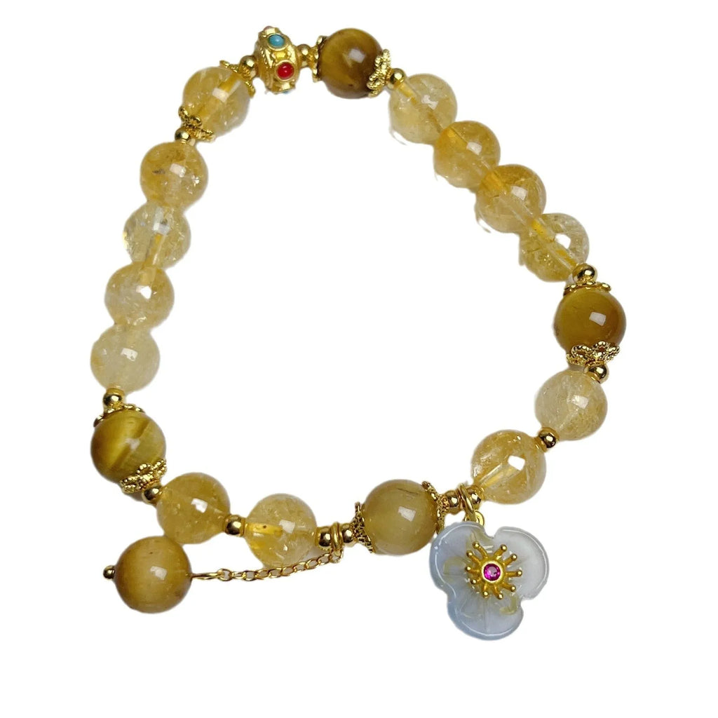 Handcrafted citrine crystal bracelet for women with a flower tassel in original design.
