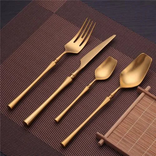 Stainless steel cutlery set with main knife, main fork, main spoon, and teaspoon in silver finish