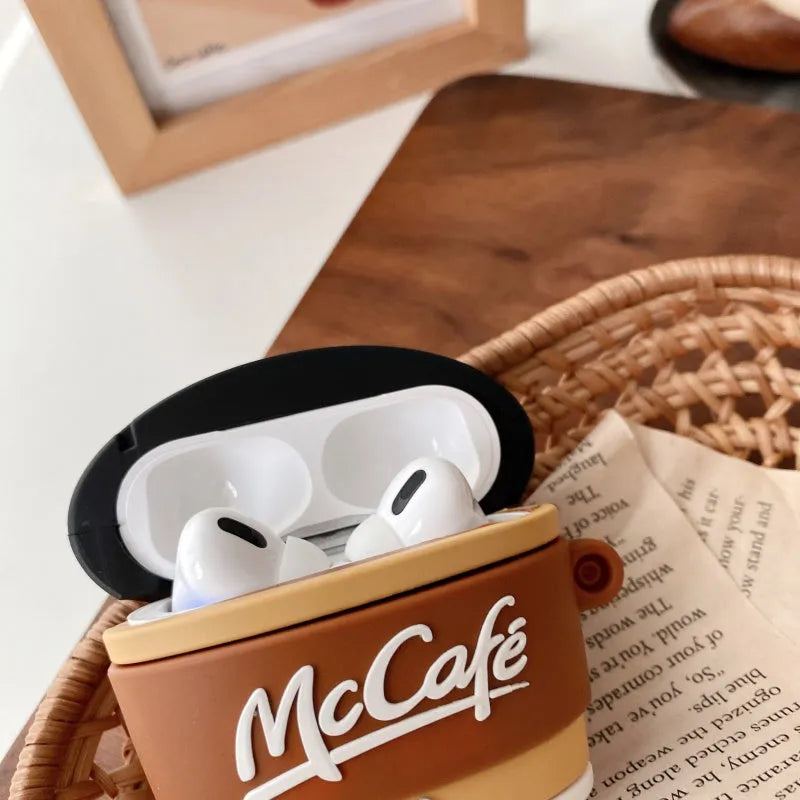 Brown silicone coffee cup-shaped earphone case for Apple AirPods with irregular printed design, front view, compatible with AirPods 1/2 and Pro 3