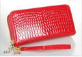 Black genuine leather women's bifold purse wallet with zip-around closure and 12 card slots