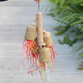 Colourful wooden shredded paper parrot chewing toy with sisal rope hanger