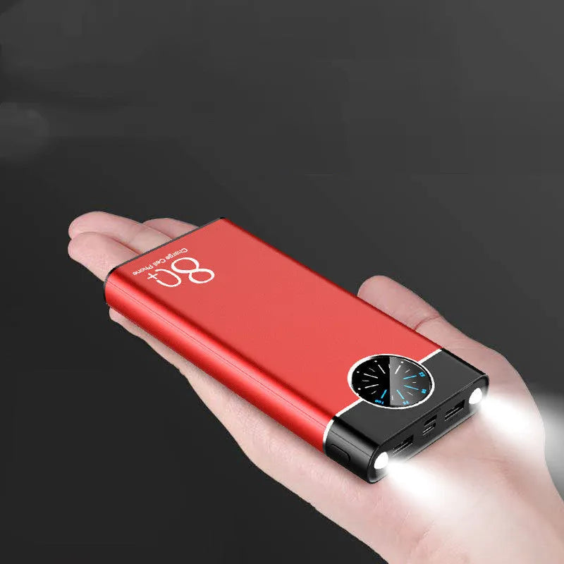 Black 20000mAh alloy portable power bank with LED flashlight showing size scale