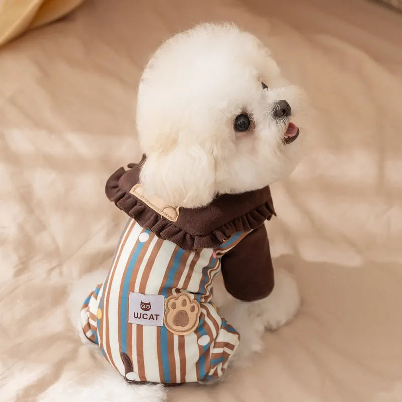 Brown small dog onesie with bear-embroidered ruffled collar, striped blue and brown body, and paw print patch