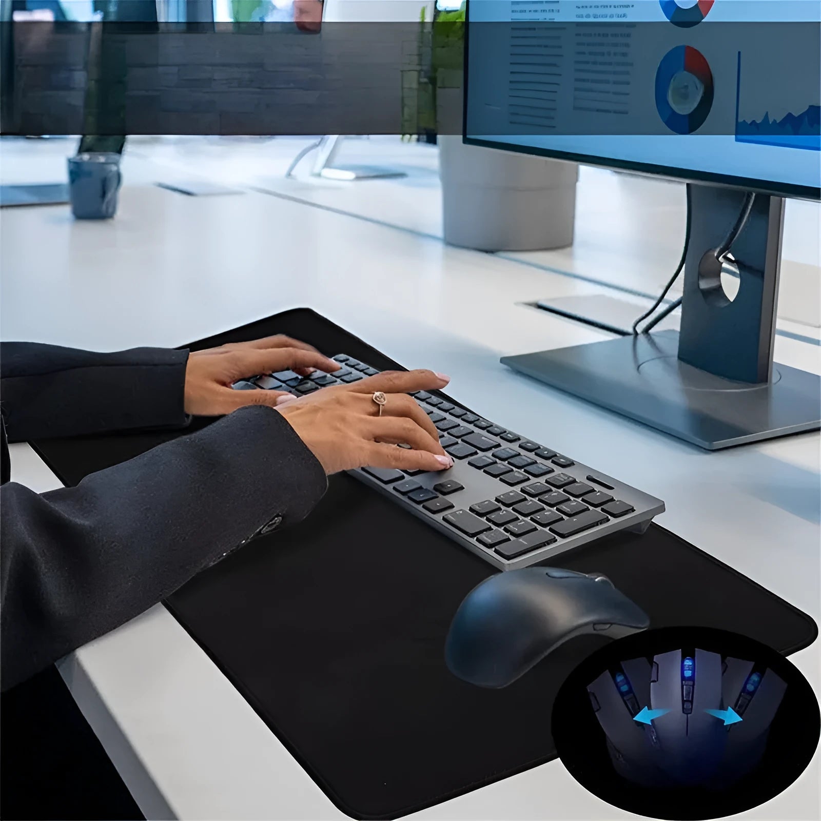 Large black and white gaming mouse pad with non-slip rubber bottom and cloth cover on a desk