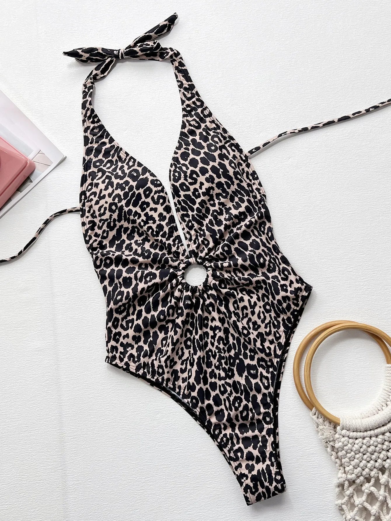 Women's leopard print one-piece swimsuit featuring a hollow-out ring design on the front.
