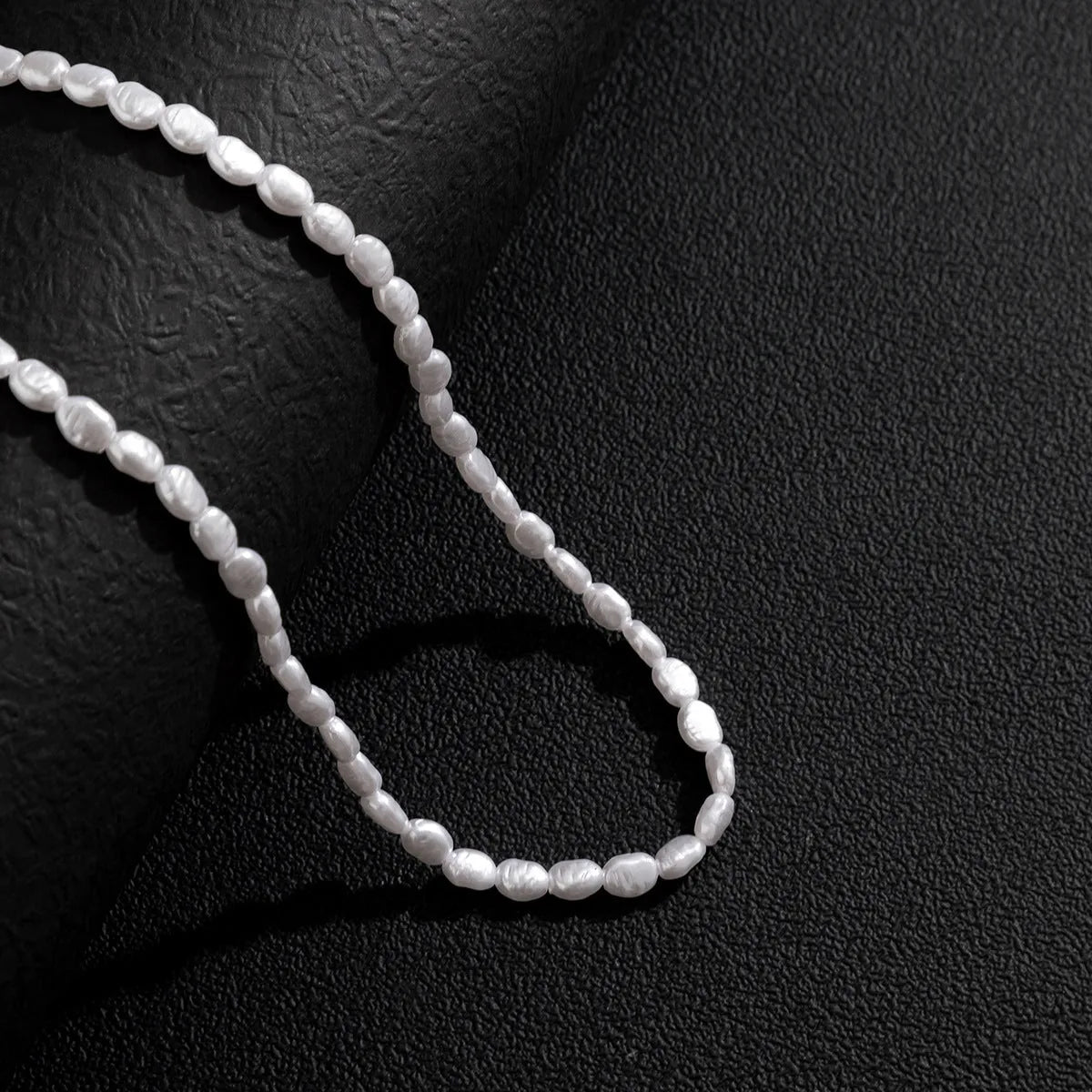 Men's white U-shaped pearl clavicle necklace with mother pearl shellfish pendant on adjustable pearl chain