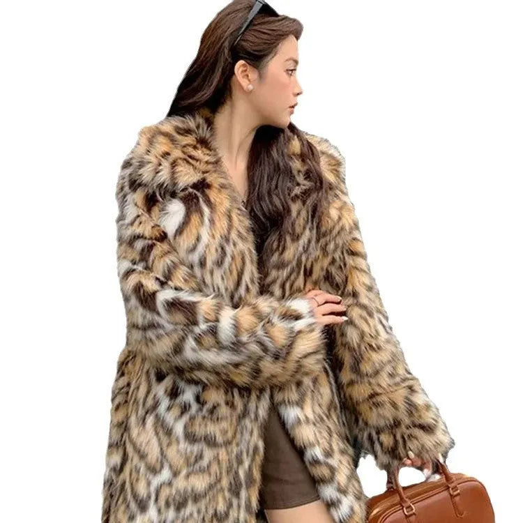 Long grey faux fur coat with a detachable fur collar and pockets on a model.