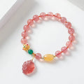 Women's strawberry quartz crystal bracelet with nine tail fox bead design