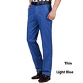 Men's high waist loose fit jeans in blue wash with zipper fly opening