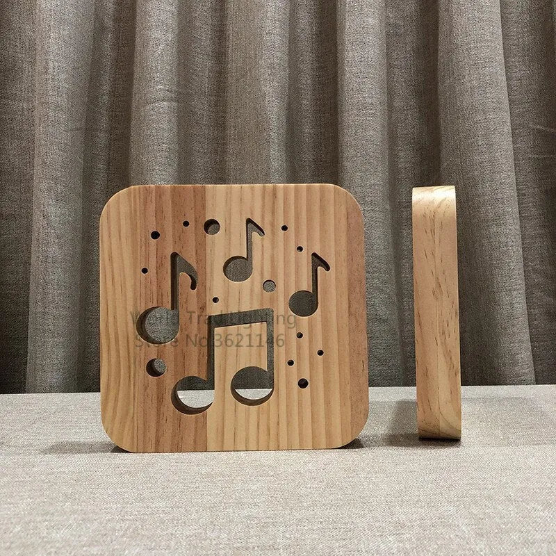 Solid pine wood cube USB atmosphere lamp glowing with warm white LED light on a wooden surface.