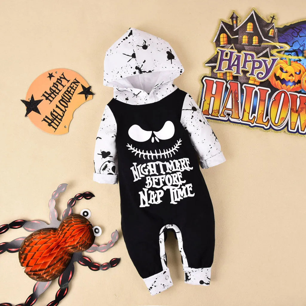 Black cotton hooded Halloween romper for children with long sleeves on a hanger