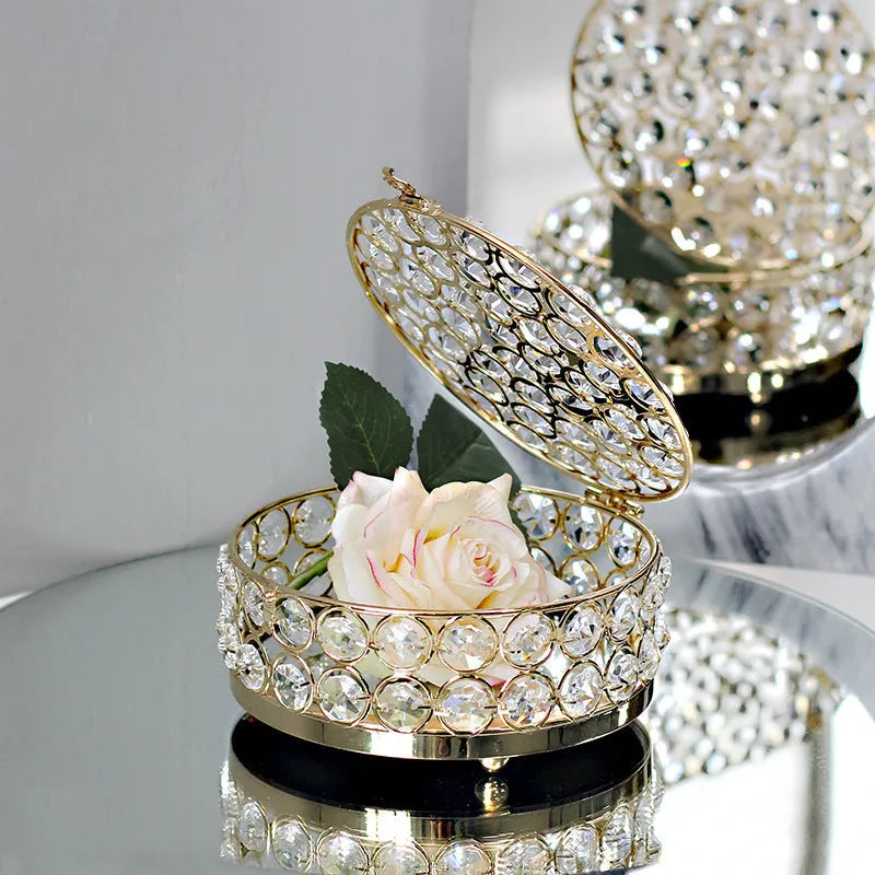 Transparent crystal glass jewelry box with a French gold metal frame in a European style.