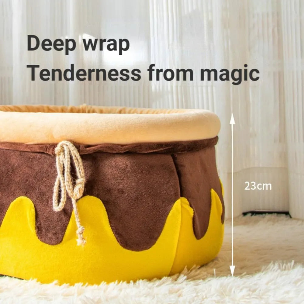 Pink or yellow honey pot-shaped enclosed cat bed with a magic wand decoration and a removable cushion.