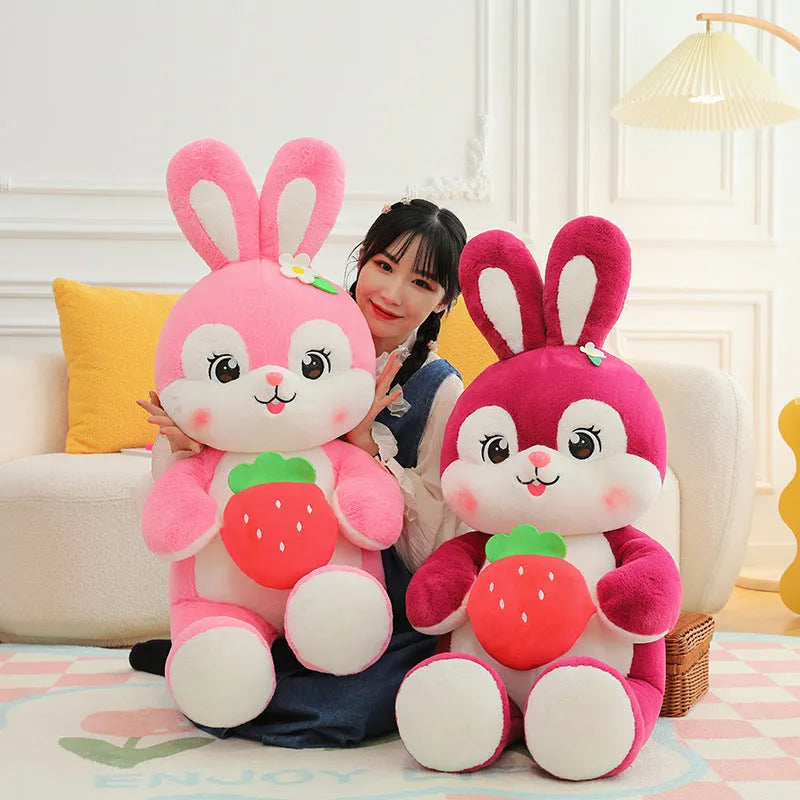 Pink strawberry rabbit plush toy doll pillow with soft furry fabric on white background