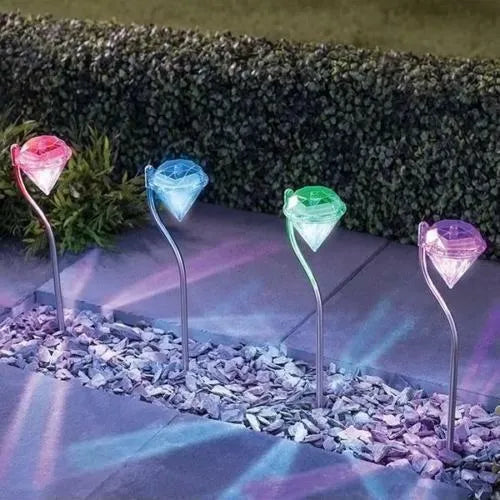 White solar powered diamond-shaped garden light for outdoor decoration.