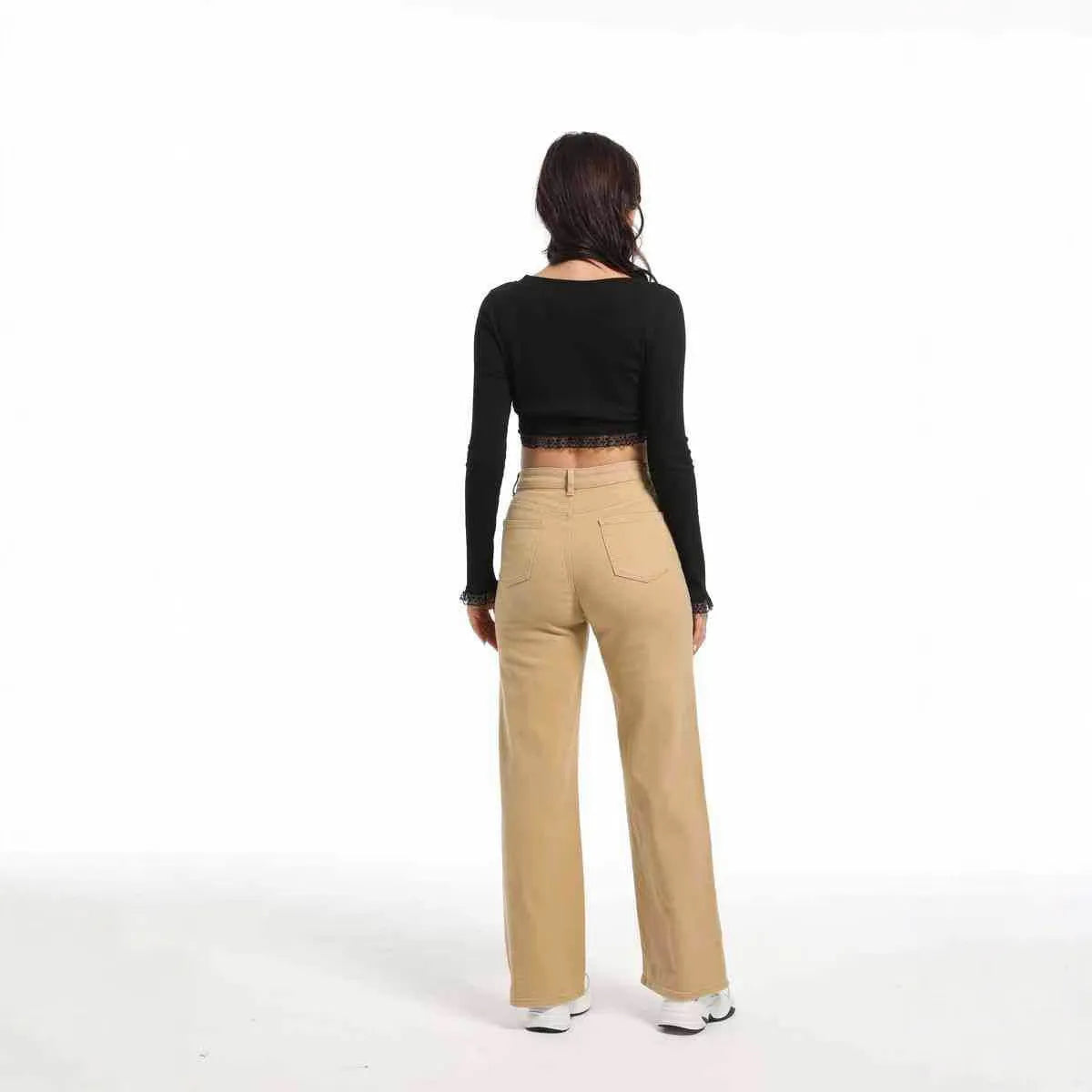Women's apricot straight-leg wide trousers with a high waist on a hanger.