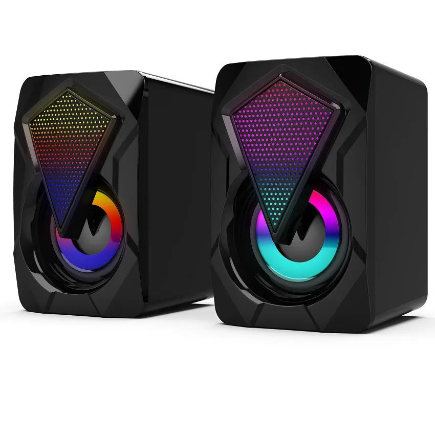 X2 RGB USB desktop multimedia speaker pair with extra bass, wired connection, and colourful lighting on a desk