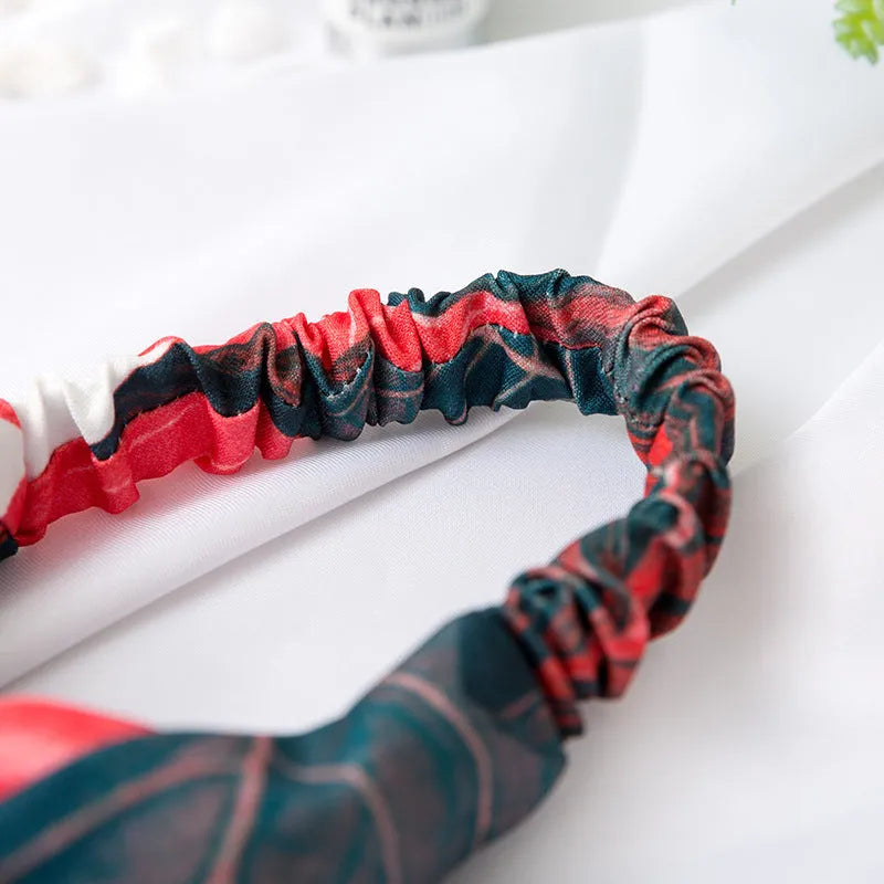 Red banana leaf pattern women's cloth headband with cross hair detail design