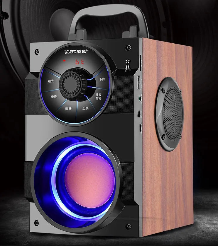 Black portable mini home audio system with subwoofer, cable, and USB power connection.