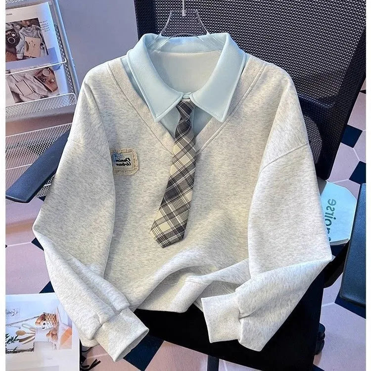 Women's fake two-piece sleeveless sweater top with tie polo collar and plush fabric, blue or gray, cropped length.