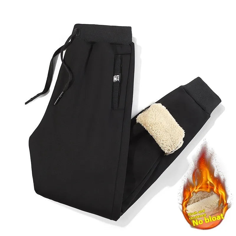 Men's grey fleece-lined cotton track pants with elastic waistband in oversized fit