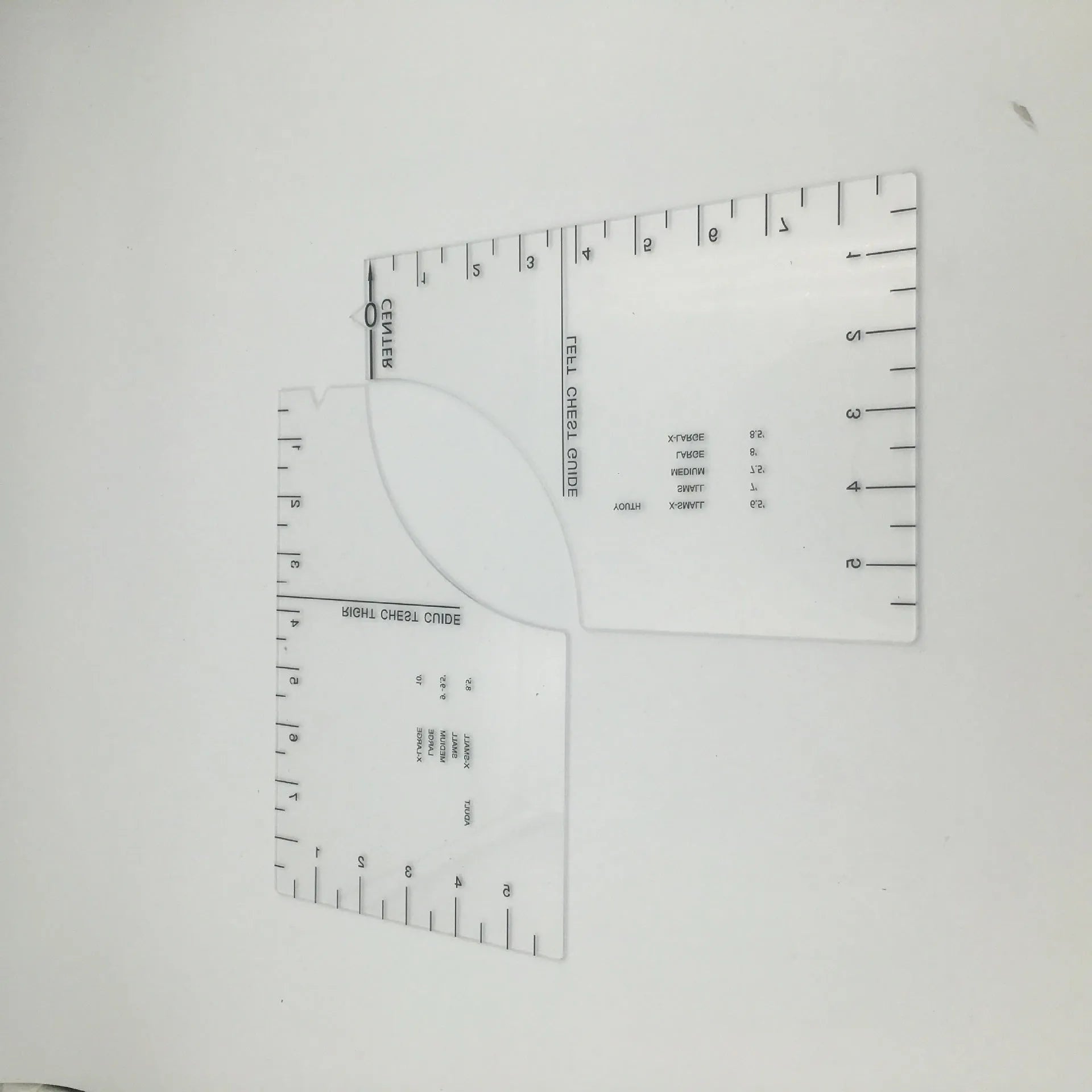Transparent acrylic sewing ruler measuring 10 by 6 inches for T-shirt patch alignment