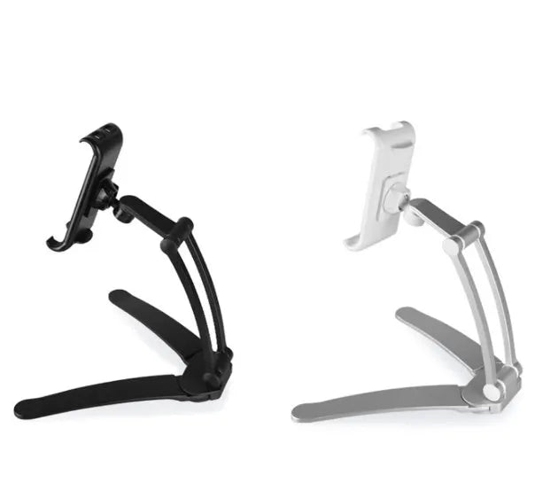 Silver aluminium desktop tablet stand holding a tablet, showing 360-degree rotation and dual adjustable clip design.
