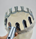 Silver metal fruit picker with 15cm cutting ring and cotton collection bag on a branch