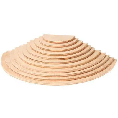 12-piece wooden arch bridge rainbow building blocks made from New Zealand pine with light lacquer finish on a flat surface