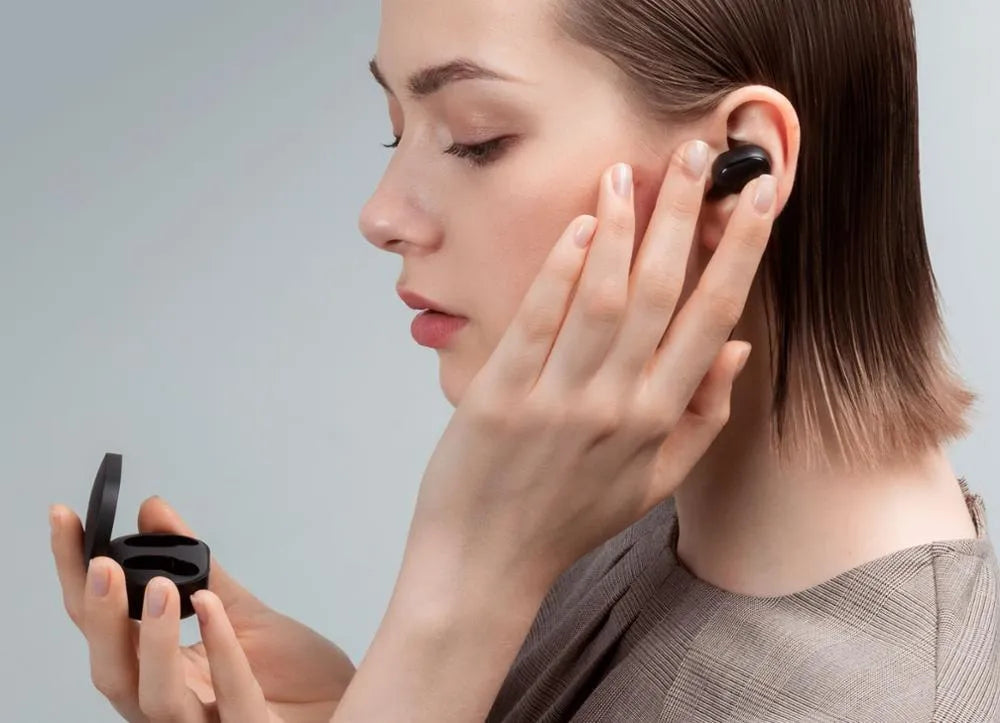 Black Redmi AirDots 2 true wireless earphones with charging case and three sizes of silicone ear tips.
