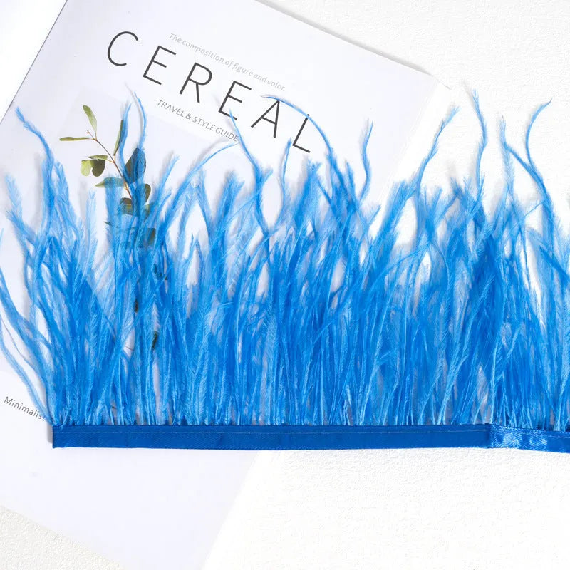 Decorative feather cloth strip in multiple colours including white, black, and mint green for DIY clothing and craft projects
