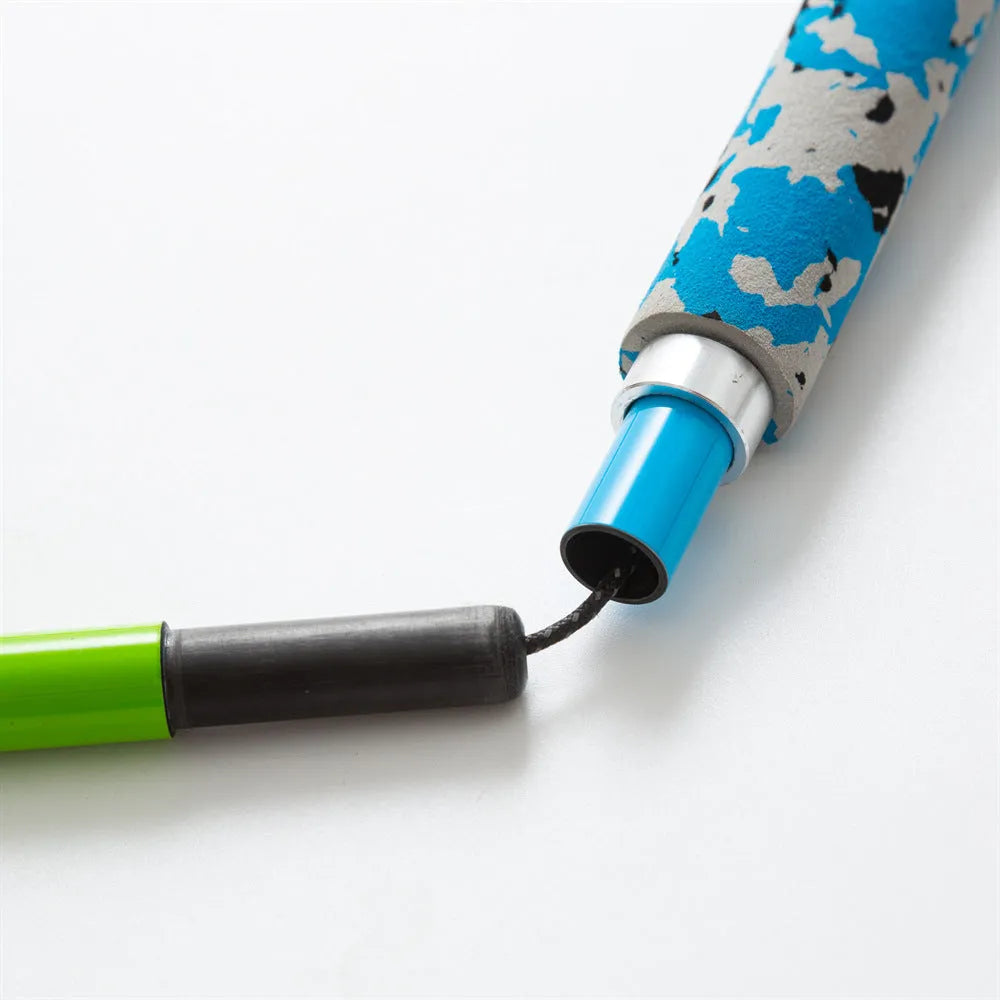 Ultralight high modulus carbon fibre five-section folding trekking pole in colourful finish against outdoor background
