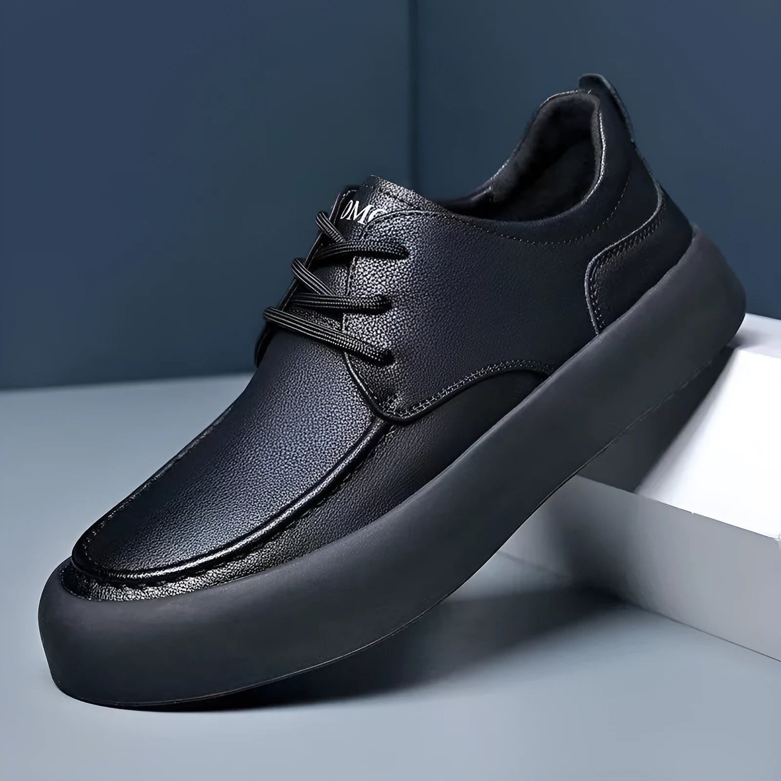 Men's brown and black lace-up casual platform trainers with a round toe and flat heel.