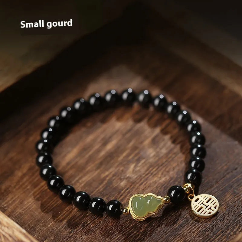 Black obsidian bracelet with a Hetian jade gourd charm, showing geometric beads in 6mm, 8mm, and 10mm size options.