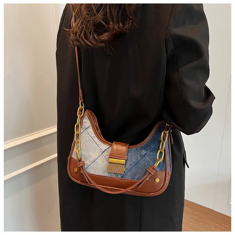 Brown denim women's shoulder bag with diamond mesh and chain detail, bucket shape.