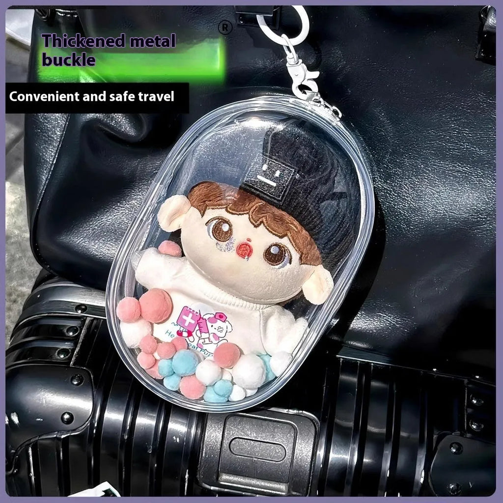 Transparent PVC cube storage bag with cartoon keychain and colourful ball in avocado green.