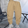Man wearing loose-fit, cropped bamboo fibre casual trousers in Army Green.