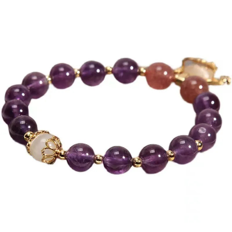 Handmade copper women's bracelet with a drop-shaped real gold longevity lock charm and natural amethyst accents.