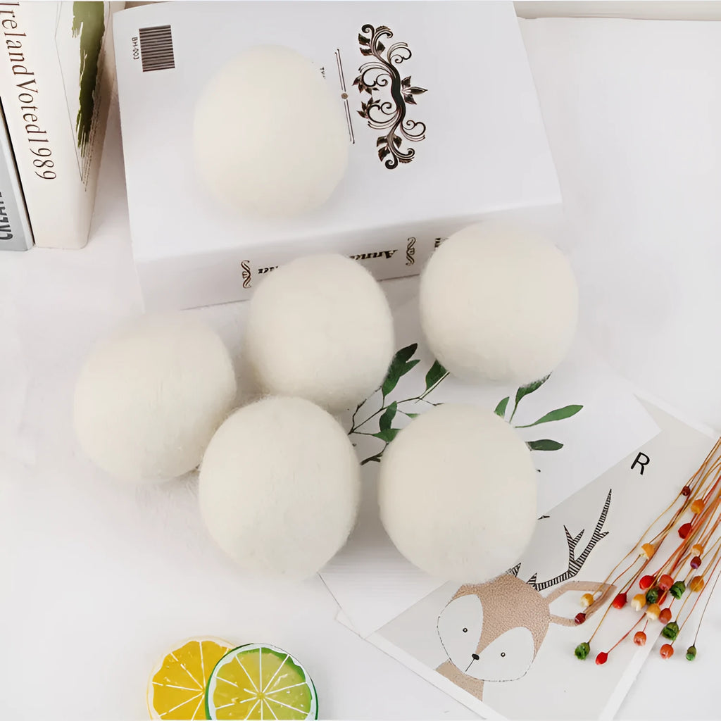 Wool laundry drying ball in various sizes with cotton storage bag for tumble dryer use